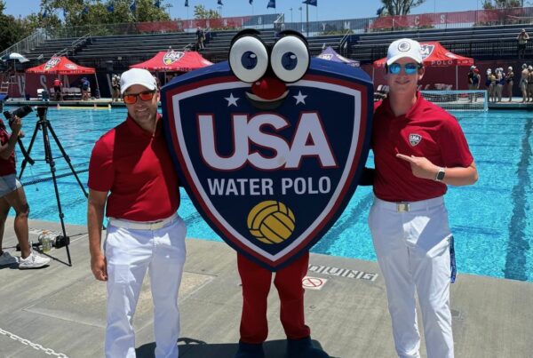 Refereeing at the 2025 Junior Olympics, saying hello to the USA Water Polo mascot, Shieldy
